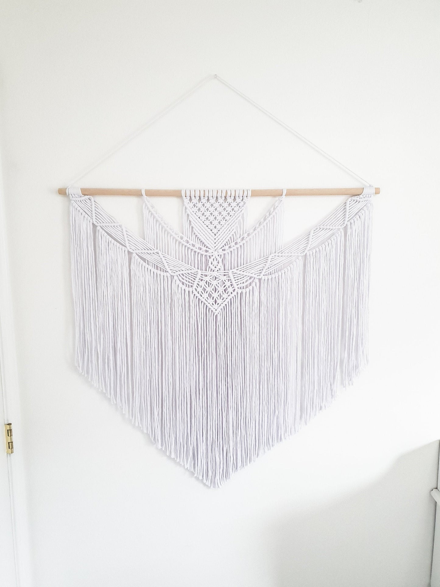 Pure white large macrame wall hanging on a wood rod, 3 feet wide and 3 feet long