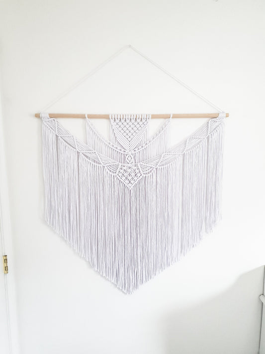 Pure white large macrame wall hanging on a wood rod, 3 feet wide and 3 feet long