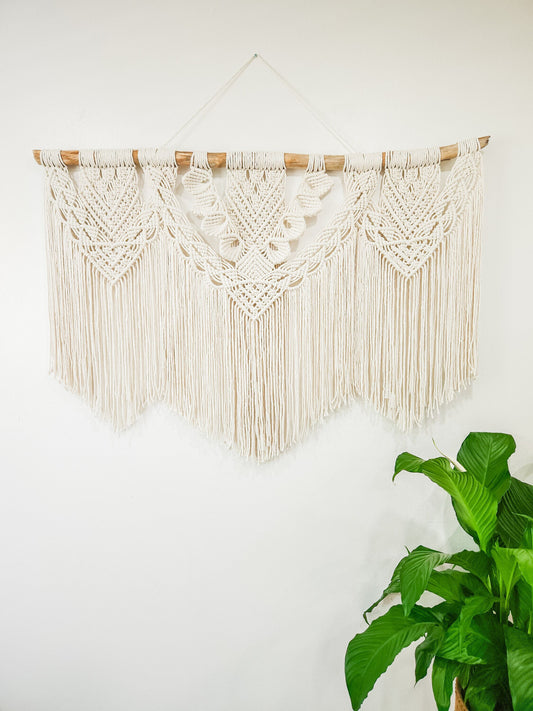 Natural white (beige) macrame wall hanging on driftwood. Four feet wide, almost 3 feet long.